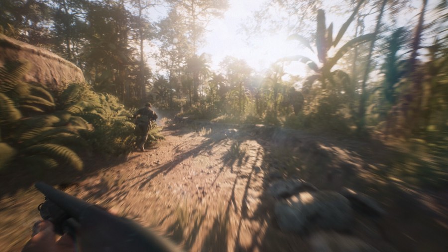 First-person view of a shotgun on a jungle dirt trail