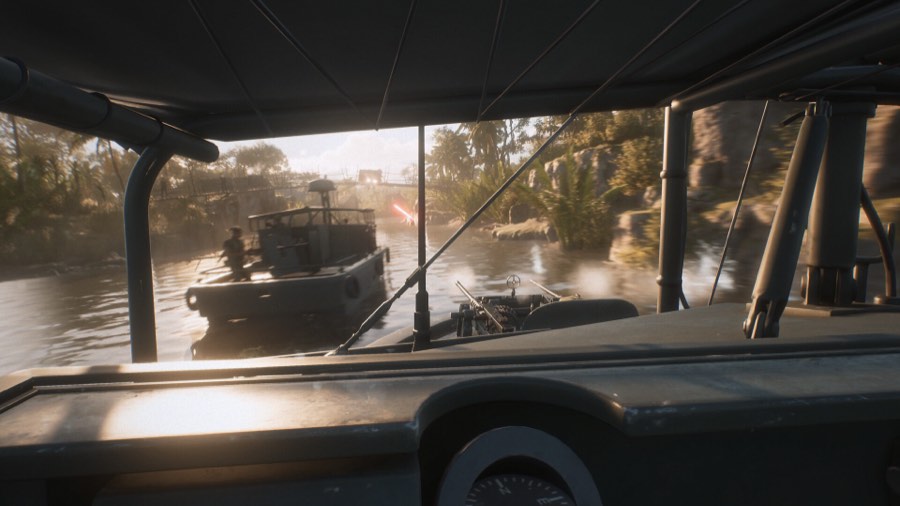 View from under a boat canopy toward a river patrol boat
